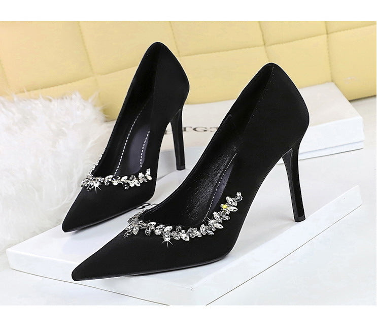 Taye Rhinestone Suede Pumps