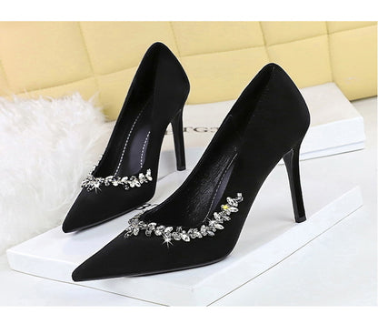Taye Rhinestone Suede Pumps